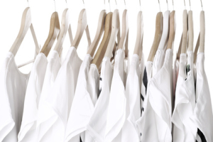 white clothes on hangers close up